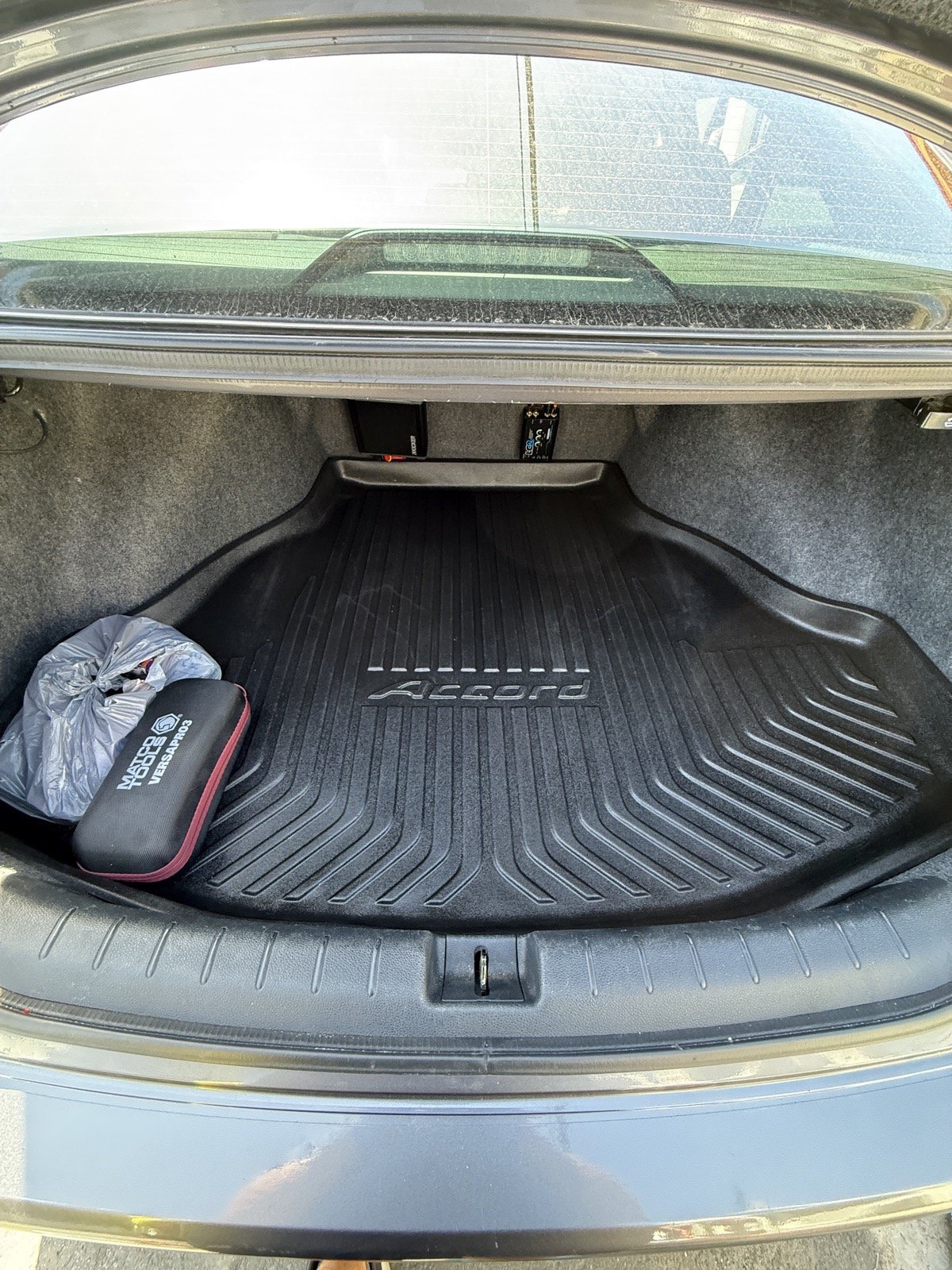 Same Honda Accord trunk after detail — clean, vacuumed, and conditioned liner