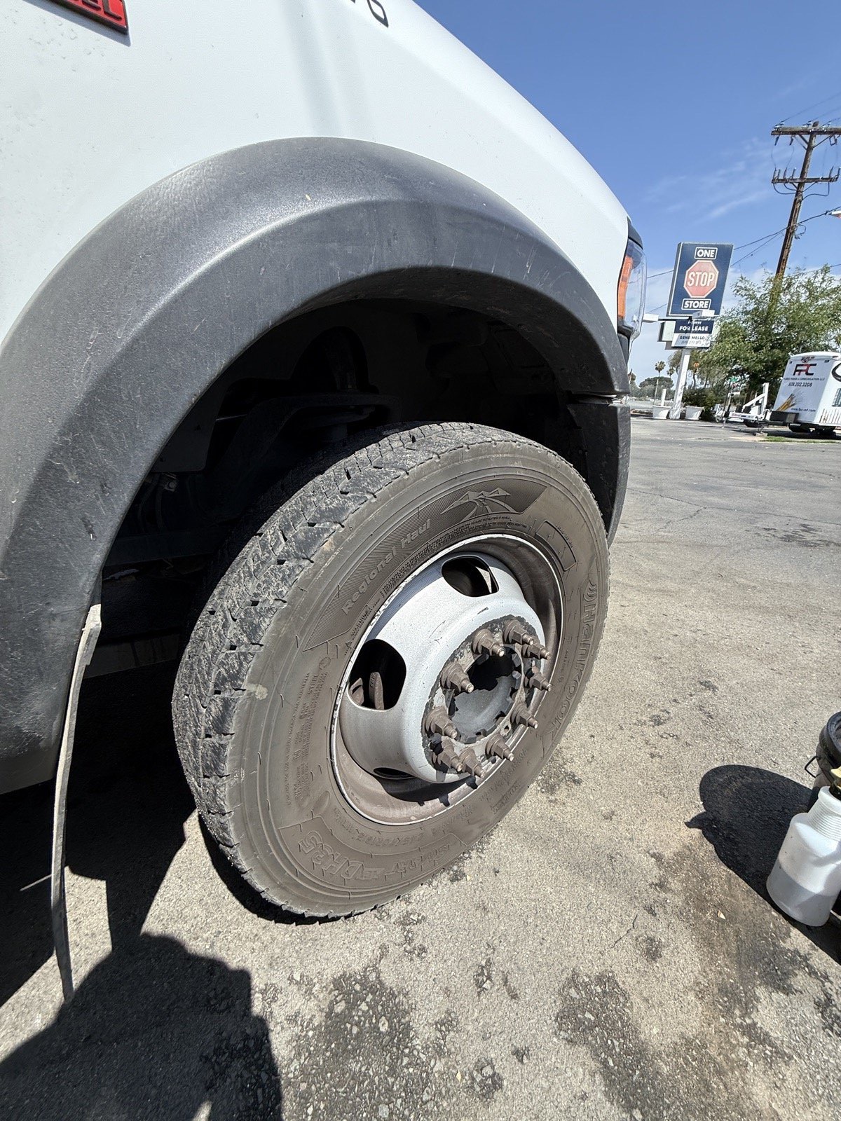 Fleet truck wheel before cleaning, with heavy brake dust and oxidation